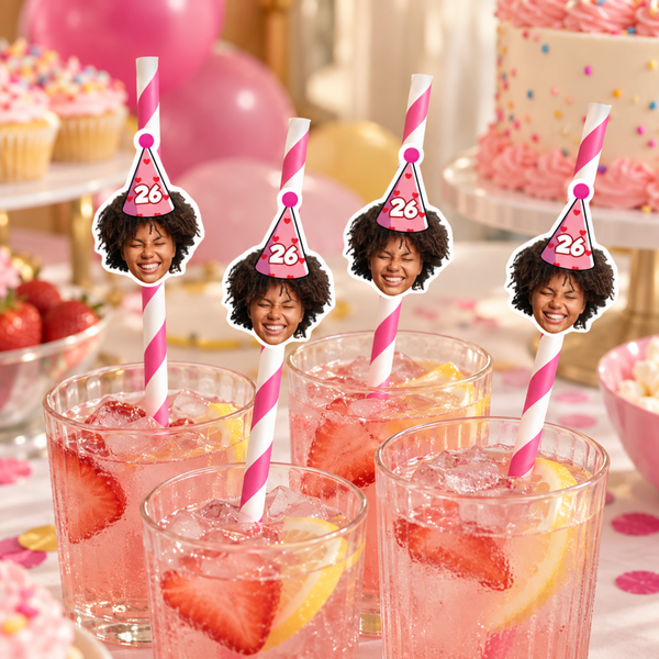 Personalized photo party straws with pink striped paper straws and face toppers in party hats in glasses of pink lemonade