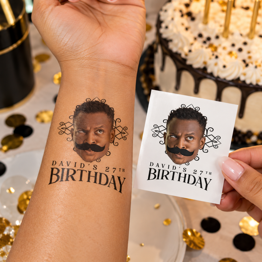 Custom face temporary tattoo with photo and David's 27th Birthday text on a wrist next to the printed tattoo sheet