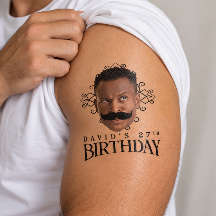 Large personalized photo temporary tattoo with custom birthday text applied on an upper arm