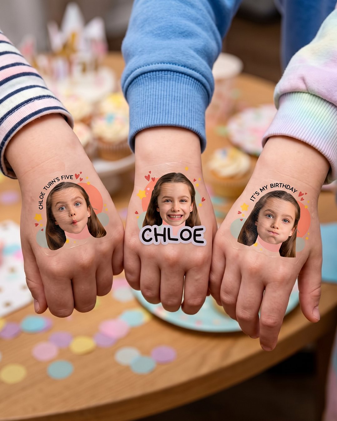 Custom face temporary tattoos worn on three hands