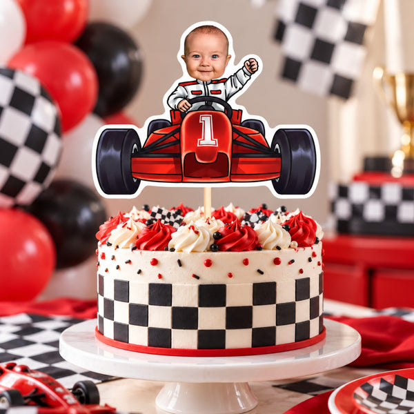 Personalized race car cake topper with a baby's face and number 1 on a red and white checkered racing birthday cake with red and black balloons